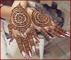 a woman's hand with henna tattoos on it and the words sana mehn