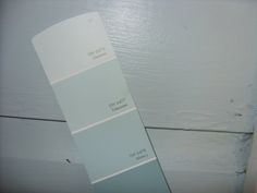 a paint swatch sitting on top of a white door