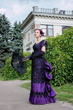 Prompter gives the order to the orchestra and your gentleman leads you to the promenade. The sound of a trumpet. You take your positions on the floor. Spectacular Victorian Ball begins! Inspired by this beautiful romantic era we created a lot of our best dresses. And here is one more exquisite model - violet Victorian Ball Lacy Gown with the flowers on the backside for a true Victorian fashionista. The dress consists of a bodice with a few steel bones for the slight shaping and the skirt. On the Purple Victorian Dress, Victorian Evening Dress, Victorian Corset Dress, Victorian Ballgown, Victorian Ballroom, Gown Victorian, Elain Archeron, Victorian Ball, Gown Purple