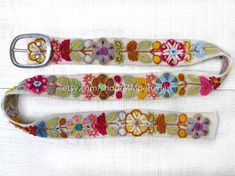 Peruvian embroidered belt floral natural organic dyes IVORYThese belts are densely embroidered using dozens of colors naturals and each one is unique. Elegant floral design and a pleasure to wear, it will bring joy to you through its visual beauty as you will want to wear it time and time again.Each belt 5 sets of holes spaced 2" apart so they are versatile. You can wear the same belt on your waist or hips. They also stretch slightly, like a pair of jeans, and will conform to your body after a f Vintage Embroidered Festival Belt, Vintage Embroidered Belt For Festival, Spring Festival Fabric Belt, Multicolor Fabric Belt In Folk Style, Bohemian Fabric Belt For Festivals, Multicolor Folk Fabric Belt, Folk Style Multicolor Fabric Belt, Adjustable Belts For Spring Festival, Bohemian Multicolor Belts For Spring