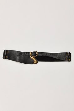 Designed to add an effortlessly essential touch to absolutely every outfit, this so cool hip belt is featured in a luxe leather fabrication and asymmetric style with defined metal buckle at center for a super cool finish. | Hampton Hip Belt by Free People in Black, Size: S/M Chic Black Belt Buckles With Brass Detail, Chic Black Belt Buckles With Brass Buckle, Chic Leather Belt With Brass Buckle, Chic Adjustable Belt With Brass Buckle, Edgy Leather Belt, Edgy Leather Belts With Belt Loops, Chic Black Belt With Brass Buckle, Black Leather Corset Belt With Self Belt, People Logo