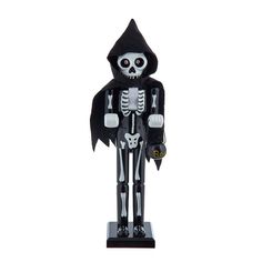 a skeleton figurine with a black hat and hood