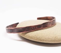 Our rustic copper bracelet is hand forged from rich jewelers copper. The cuff is hammered for texture and shine, then lightly oxidized to bring out the detail. A Roman numeral VII (7) or XXII (22) is hand stamped in the center of the cuff to represent your 7th or 22nd year together. If you would like your anniversary date stamped instead please just let us know. Copper is the traditional 7th and 22nd wedding anniversary gift. Our current processing time is 5-7 business days. This is the amount o 22nd Wedding Anniversary, Mens Copper Bracelet, Roman Numerals Dates, Bronze Anniversary Gifts, Roman Numeral Bracelet, 22nd Anniversary, Hammered Cuff Bracelet, Bronze Anniversary, Gothic Bracelet