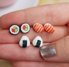 small miniature sushi pins in the palm of someone's hand