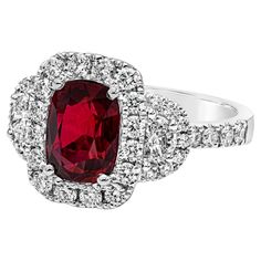 A contemporary piece of jewelry, showcasing a GRS certified color-rich 2.32 carats cushion cut ruby, set on a classic four prong setting. Accented by a halo of round cut diamonds that continue on to the shank in a half-way composition, weighing 0.74 carat total. Flanked by two half moon diamonds weighing 0.29 carat total. Finely made with 18K white gold. Size 6.5 US, resizable upon request. Roman Malakov is a custom house, specializing in creating anything you can imagine. If you would like to r Ruby Set, Custom House, Three Stone Engagement, Three Stone Engagement Rings, Ruby Diamond, Three Stone, Round Cut Diamond, Cushion Cut, Half Moon