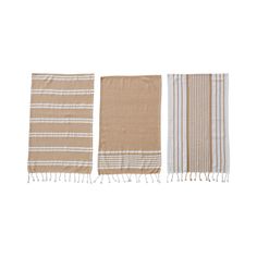 three tan and white striped towels with fringes on each side, one in the middle