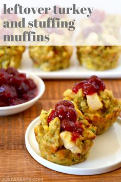 two small muffins on a plate with cranberry sauce