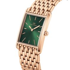 Expertly crafted with precision and elegance, the Daniel Wellington Bound 9-Link Emerald Sunray Watch DW00100704 is the perfect addition to any wardrobe. Made with high-quality materials, it offers a stunning Emerald Sunray dial and a 9-link bracelet for a sophisticated and timeless look. Elevate your style and make a statement with this exquisite watch. Timeless Green Watch Accessories With Metal Dial, Formal Green Watch With Polished Finish, Daniel Wellington Square Watch, Luxury Green Watch With Metal Dial, Metal Watch With Polished Finish, Rectangular Dial, Thomas Sabo Ring, Thomas Sabo Bracelet, Daniel Wellington Watch, Blue Topaz Bracelet