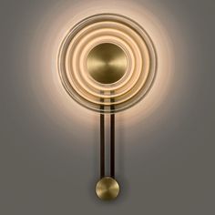 a wall mounted light with a circular design on it