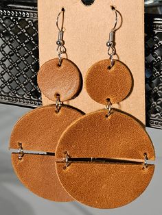 Handmade genuine leather double circle earrings. Trendy Leather Earrings For Everyday, Trendy Brown Circular Earrings, Trendy Brown Circle Earrings, Modern Brown Leather Earrings, Minimalist Brown Leather Earrings, Brown Leather Round Jewelry, Brown Leather Minimalist Earrings, Brown Leather Jewelry, Knot Earrings