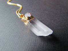 This listing is for one Gold Quartz Crystal and Druzy Necklace.This is a unique one of a kind statement piece that truly is beautiful.Pendant size with bail: 48mmx15mmx15mmThis beautiful pendant comes on a gold filled chain and is 18 inches or 30 inches long. Please choose your desired length at checkout.I ship all additional items for free as long as they are paid for on the same invoice.Please check out my other listings for more Necklaces :https://www.etsy.com/shop/mizzoktober?section_id=1272 Unique White Quartz Jewelry, White Jeweled Necklace For Gift, White Quartz Necklace For Gift, Druzy Necklace, Rolo Chain, Quartz Pendant, Quartz Necklace, Jewelry Gold, Gold Filled Chain