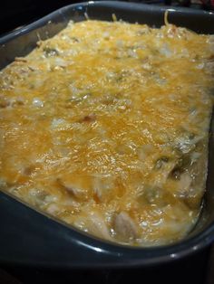 a casserole dish filled with cheese and meat