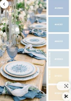 an image of a table setting with blue and white plates, flowers and napkins