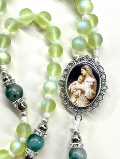 Welcome to my shop, Creating Still Moments Please visit my shop for other listings  Thanks for visiting https://www.etsy.com/shop/CreatingStillMoments?ref=sh-carousel-1  Handmade Rosary Handmade Rosary pale green rosary Mary and Child centerpiece glass beads Indulgence crucifix Catholic gift Communion Confirmation gift Catholic gift confirmation gift Godparent gift  These rosaries are beautiful and would make a wonderful First Communion/Reconciliation or Confirmation gift, wedding gift, or RCIA Adjustable Miraculous Medal For Gift, Spiritual Jewelry With Miraculous Medal As Gift, Mother's Day Spiritual Rosary, Adjustable Rosary With Miraculous Medal Gift, Handmade Green Rosary As A Gift, Spiritual Crucifix Rosary As Gift, Handmade Green Rosary Bracelet Gift, Rosary Mary, Green Rosary