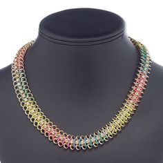 Add bright-colored fun to your style with this delightful chainmaille necklace. Neon multicolored nylon is woven through the brass chain, which is embellished with clear glass rhinestone cupchain. Rainbow Metal Jewelry For Jewelry Making, Multicolor Metal Necklace Nickel-free, Nickel-free Multicolor Metal Necklaces, Nickel-free Multicolor Metal Necklace, Rainbow Metal Jewelry With Adjustable Chain, Beaded Medallion, Chainmaille Necklace, Neon Rainbow, Bright Colored