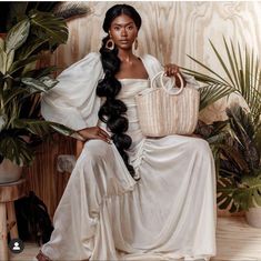 a woman sitting on a chair holding a basket