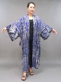 One of a kind handmade tie dye kimono/cardigan. Easy to wear and perfect for home lounging or fun outings. One size fits most. 👗 ℹ️ PRODUCT DETAILS * Hand dyed tie dye * Soft and breezy fabric * Open front * 1 removable sash included * 2 front pockets * Side slits * Loose fit * All day comfort 👗📏FIT & SIZING * Size: One size fits most--up to 2XL * Bust: 60" * Waist: 60" * Hips: 60" * Arm opening circumference: 30"  * Length: 48"-49" from shoulder to hem ~Model is 5'3" tall wearing 3.5" heels, Bohemian Hand Dyed Kimono For Spring, Bohemian Blue Kimono With Natural Dye, Blue Bohemian Kimono With Natural Dye, Bohemian Hand-dyed Kimono For Spring, Spring Bohemian Hand Dyed Kimono, Spring Bohemian Hand-dyed Kimono, Indigo Long Sleeve Bohemian Kimono, Bohemian Indigo Long Sleeve Kimono, Long Sleeve Indigo Bohemian Kimono