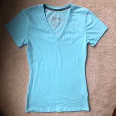 Never Worn Cotton Material Fits Like S Light Blue Cotton V-neck T-shirt, Nike Casual V-neck Top, Light Blue Nike Cotton Tops, Nike Light Blue Cotton Tops, Light Blue Fitted V-neck T-shirt, Fitted Nike Cotton T-shirt, Nike Fitted Cotton T-shirt, Fitted Blue Nike Tops, Blue Nike