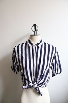 "Vintage 1980s 90s white and dark blue striped blouse. Padded shoulders.  B R A N D ++ Jacyln Smith S I Z E ++ marked a size 12 M A T E R I A L S ++ 100% Rayon C O N D I T I O N ++ good vintage condition, light wear. No holes or stains.  M E A S U R E M E N T S ++ s l e e v e   l e n g t h - 8\"  s l e e v e  w i d t h - 8\" s h o u l d e r - 18\" b u s t - 36\" w a i s t - 38\"  l e n g t h - 25\"  Please message me before you purchase if you have any questions, need additional measurements, photos or expedited shipping.  Thank you so much for looking! :)"