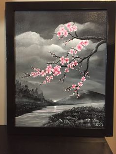 a black and white painting with pink flowers on the tree branch in front of a cloudy sky