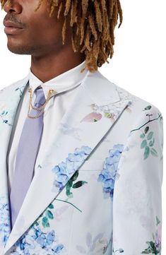 Crisp cotton patterned in watery blooms makes a sunny-day favorite of a sport coat that's styled with smartly peaked lapels and a touch of stretch to keep you moving comfortably. One-button closure Peaked lapels Nonfunctional five-button cuffs Chest welt pocket; front flap pockets; interior pocket Back vent Lined 97% cotton, 3% elastane Dry clean Made in Turkey Spring Formal Suit With Floral Print, Formal Floral Print Suits For Spring, Spring Floral Print Formal Suits, Formal Tailored Suits With Floral Print, Tailored Floral Print Suit For Formal Occasions, Tailored Floral Print Suits For Formal Occasions, Tailored Floral Print Suits For Formal Events, Tailored Floral Print Outerwear For Formal Occasions, Tailored Formal Blazer With Floral Print