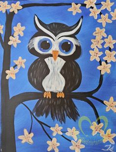 an owl sitting on a tree branch with flowers painted on it's back side