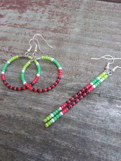 These beaded earrings feature a watermelon design perfect for summertime. Watermelon Beaded Earrings, Green Beaded Hoop Earrings For Summer, Summer Beaded Green Hoop Earrings, Summer Green Beaded Hoop Earrings, Green Beaded Earrings For Summer, Casual Handmade Beaded Dangle Earrings, Casual Green Beaded Earrings For Summer, Summer Beaded Earrings With Round Nickel-free Beads, Handmade Casual Beaded Earrings