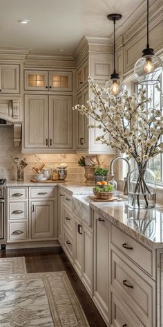 a large kitchen with marble counter tops and white cabinets, along with an area rug on the floor