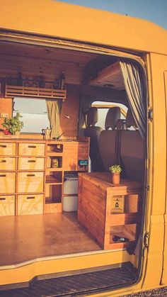 the interior of a van with drawers and storage