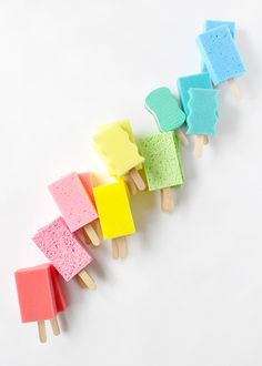 five popsicles are lined up in different colors