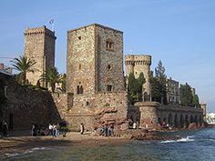 an old castle with two towers on top