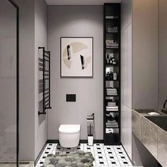 a modern bathroom with black and white tile flooring