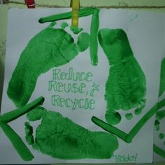 a child's hand and foot prints made with green crayons