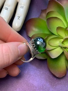 A beautiful bright green mirrored crystal ball set in either an antique bronze or silver crown setting. Crystal ball measures approximately 16mm. Coloration may slightly vary but you will receive a crystal ball similar to the one in the photo. Ring is adjustable. Witchy Ring, Ring Magic, 101 Dalmations, Photo Ring, Silver Crown, Magic Ring, Crystal Ball, Adjustable Ring, Bright Green