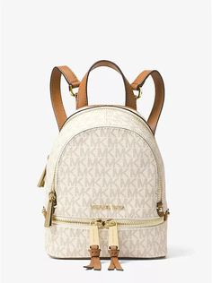 You will receive  an Authentic, New Michael Kors Rhea Mini Logo Backpack in Vanilla/acorn. Convertible: Backpack/ Shoulder/ Sling bag/ Handbag all in one with Michael Kors Dust bag! We will ship your order next business day on cleared payment  or Same business day whenever possible! New with tags • Backpack • Logo-print canvas • 69% coated canvas/17% polyester/13% cotton/1% polyurethane • Gold-tone hardware • 6.25" W X 7.5" H X 2.75" D • Handle drop: 1" • Exterior details: 2 front zip compartments • Interior details: back slip pocket, front slip pocket • Lining: 100% polyester • Zip fastening • Dust bag  included Item ships in 1 business day or same day whenever possible We will ship your order next business day on cleared payment.  When we are able, we will try to ship the same day. We al Michael Kors Backpack, Mini Mochila, Cheap Purses, Mini Logo, Mini Logos, Cheap Handbags, Cute Backpacks, Small Backpack, Cute Bags