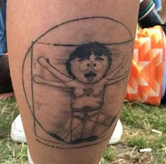 a man's leg with an image of a cartoon character on it and the words,