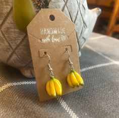 These cute handmade clay banana earrings/necklace is great for any occasion! Adjustable Novelty Single Earring Jewelry, Casual Yellow Earrings For Gift, Casual Yellow Earrings Perfect For Gifts, Casual Handmade Yellow Jewelry, Clay Jewelry With Matching Earrings For Gift, Casual Yellow Handmade Jewelry, Casual Handmade Yellow Earrings, Handmade Polymer Clay Fun Jewelry, Fun Everyday Polymer Clay Jewelry