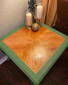 a wooden table with candles on top of it