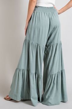 Elevate your summer style with this chic pair of mint-colored wide leg pants. Complete with a smocked waist and self-tie belt, they are both comfortable and stylish. Perfect for any fashion-forward individual. Modest Trousers, Green Flowy Pants, Tiered Pants, Palazzo Pants Outfit, Estilo Hippy, Stylish Pants, Boho Pants, Rayon Pants, Flowy Pants