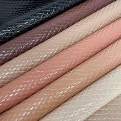 many different colors of leathers are lined up in the same pattern and color scheme