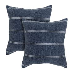 two blue striped pillows sitting on top of each other