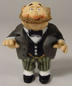 a figurine of a man wearing a tuxedo