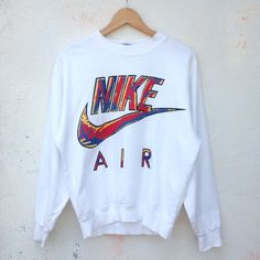 Brand : Nike Size on tag : M fit M Color : White Material : Cotton Measurement Chest : 21.5 inches Length : 24 inches Sleeve : 21 inches Condition Good used condition. A small pinhole at the back. A minor unnoticeable stain at front (at letter I). Please refer pictures. Worldwide shipping via DHL EXPRESS (3-7 days only to arrive). Please leave your phone number while making purchase. No customs tax or fees. No refund, return or cancellation. Swoosh Logo, White Material, Vintage Nike, Dhl Express, Vintage 90s, Favorite Outfit, Nike Air, Gender Neutral, Jumper