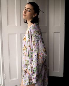 Our shorter length, kimono robe in our feminine Lilac print, from the Meadow Creatures collection is an elegant answer to your nightwear solutions. Thoughtfully fashioned from sustainable fibres; this sumptuous piece of nightwear has been crafted from wood pulp into a premium viscose satin for a lustrous finish that’s dreamy, soft on the skin. A luxury piped trim provides an opulent finish whilst the matching tie belt can double up as a hair accessory as you wind down from the day.
 Key features Spring Silk Sleepwear With Relaxed Fit, Spring V-neck Sleep Robe, Spring Silk Sleepwear In Relaxed Fit, Silk V-neck Robe For Loungewear, Floral Print Sleepwear With Kimono Sleeves, Floral Print Long Sleeve Sleep Kimono, Spring Loungewear Robe Relaxed Fit, Silk Kimono With Floral Print For Loungewear, Printed Sleepwear With Kimono Sleeves For Loungewear