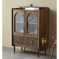 a wooden cabinet with glass doors and drawers