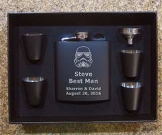 a flask and shot glasses in a black box with the name steve best man on it