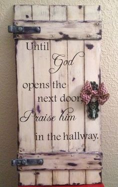 an old door with a bow on it that says, until god opens the next doors please him in the hallway