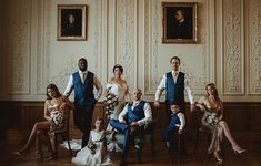 a group of people in formal wear posing for a photo