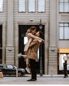 a man and woman are dancing in the street