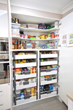 an organized pantry with lots of food in it